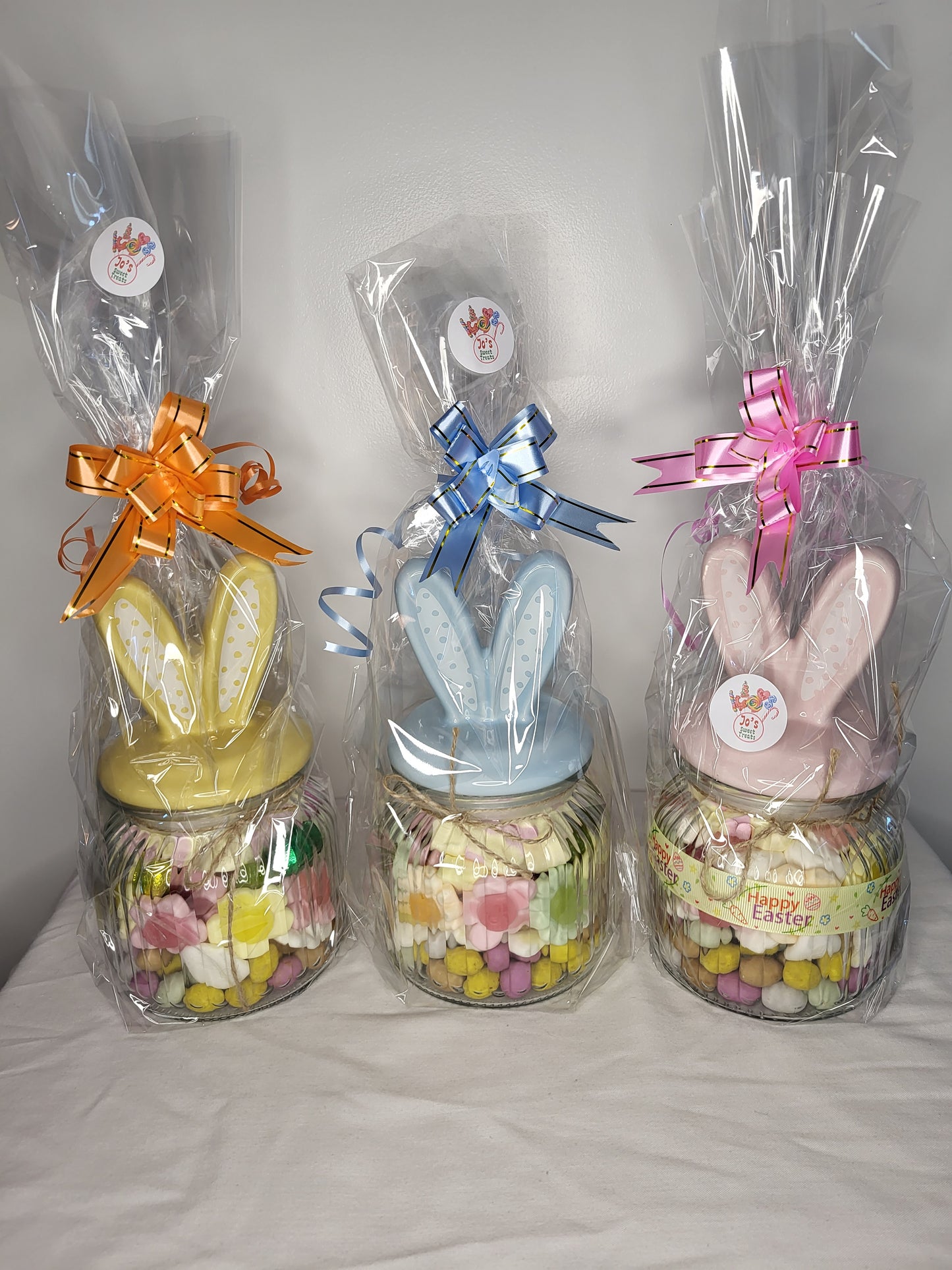 Easter themed glass jars with bunny ears.