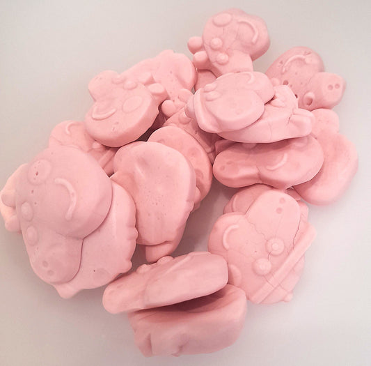 A pile of pink foam sweets shaped like characters from the Peppa Pig kids' show.